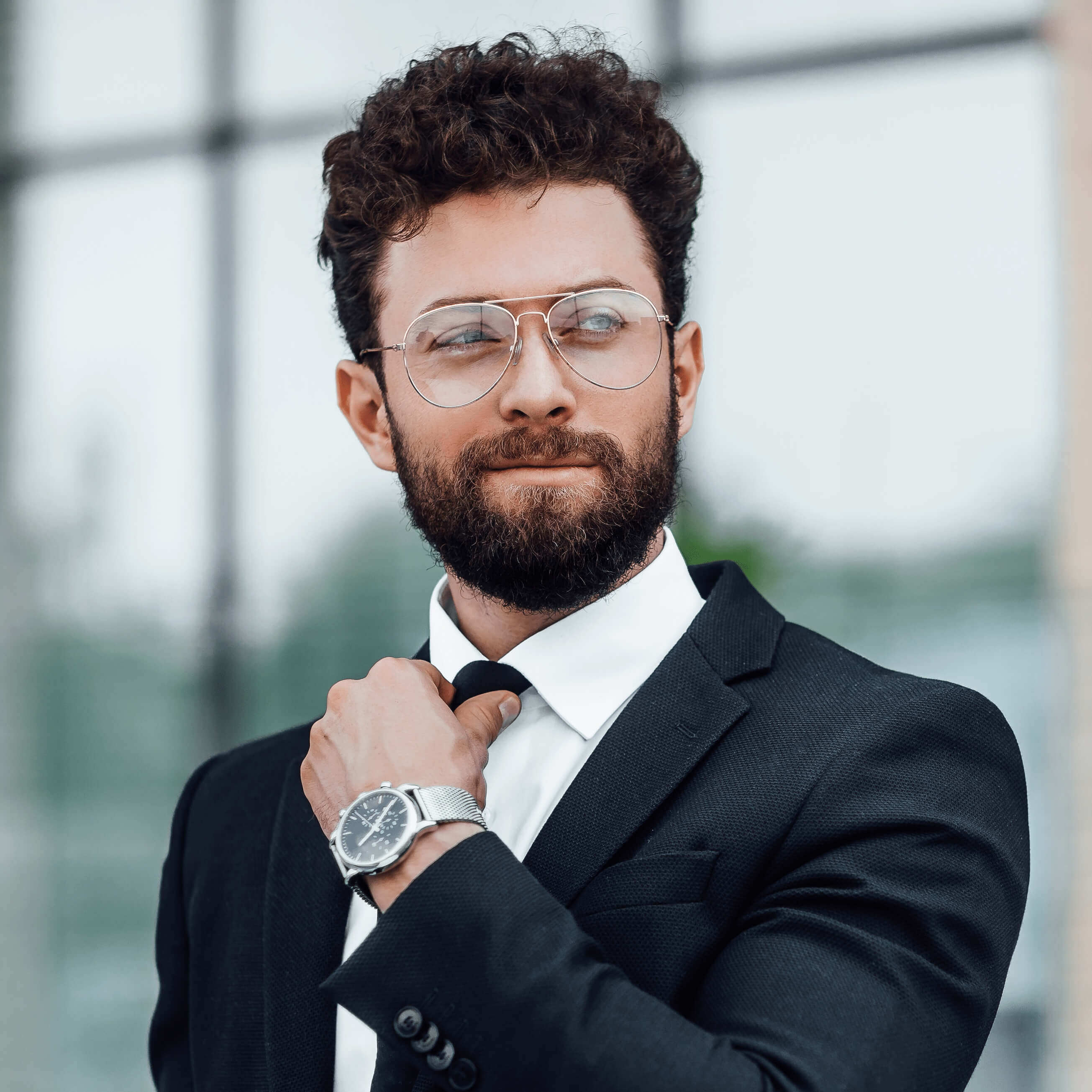 portraithandsomemanblackbusinesssuitwithwatchhishand11_azodu_2610