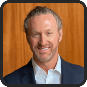 Portrait of a smiling man used as a customer testimonial image on the Lotto Champ website.