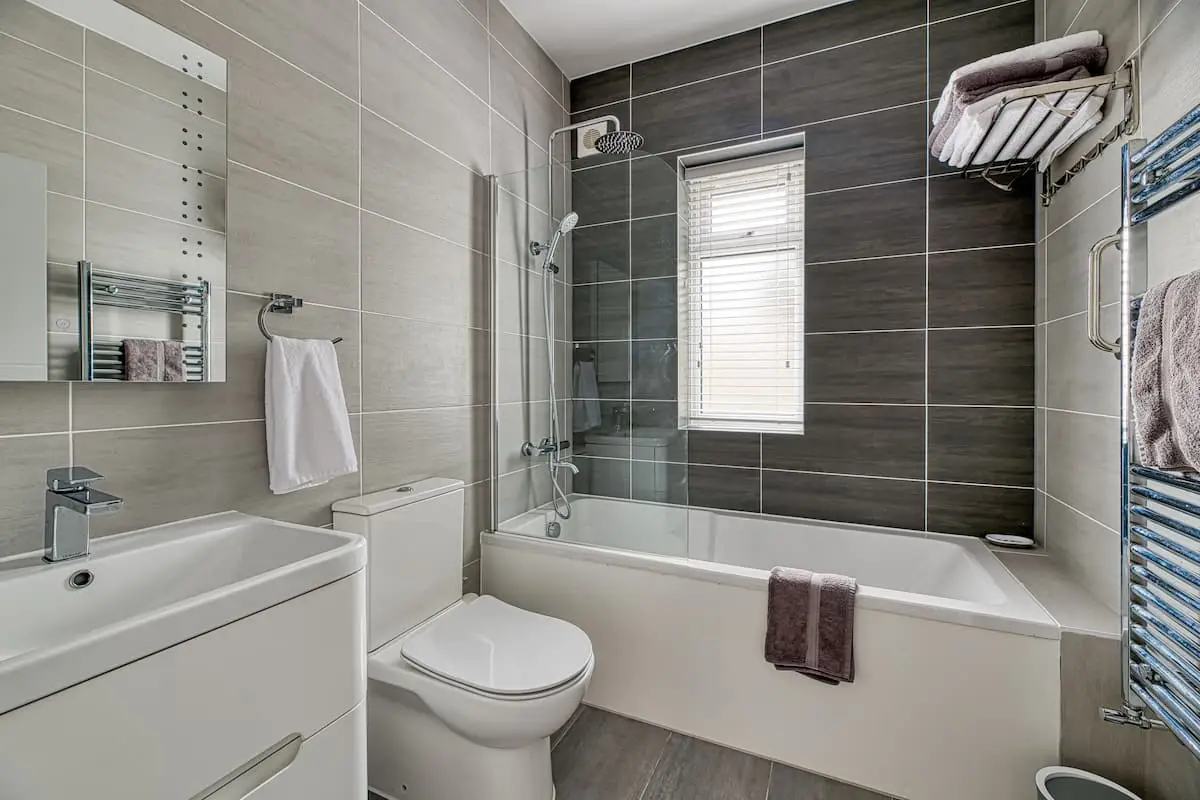 Bathroom with bath and shower