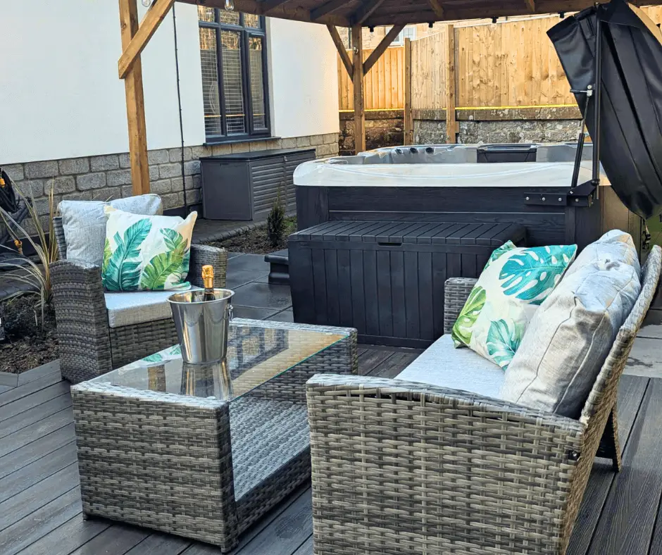 Enclosed garden with hot tub gazebo and seating