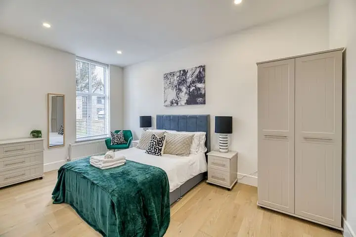 Bedroom with green throw