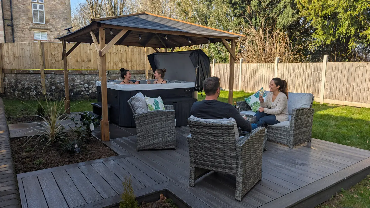 Guests relaxing by the hot tub