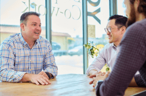 Jack P. Flaherty in a confidential executive coaching session guiding senior leaders through board-level risk, digital transformation, and organizational change