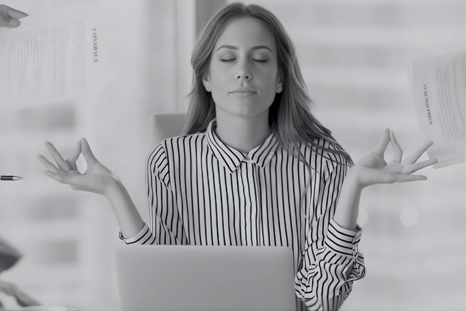 Black and white photo of a young consulting professional finding clarity and protecting their mental health.