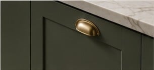 Green replacement kitchen door with brass cup handle