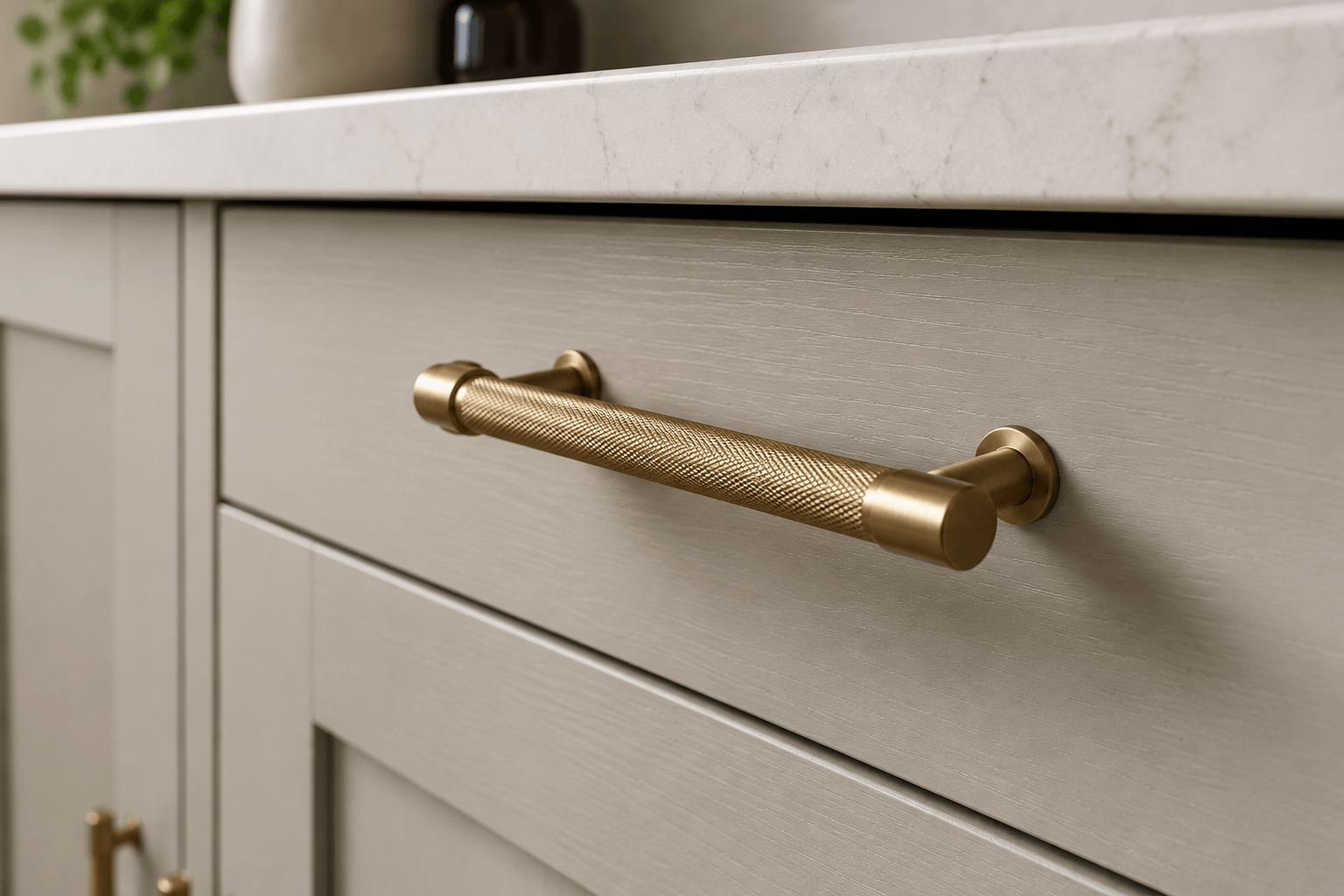 Brushed brass replacement kitchen handle on flat-front cabinetry